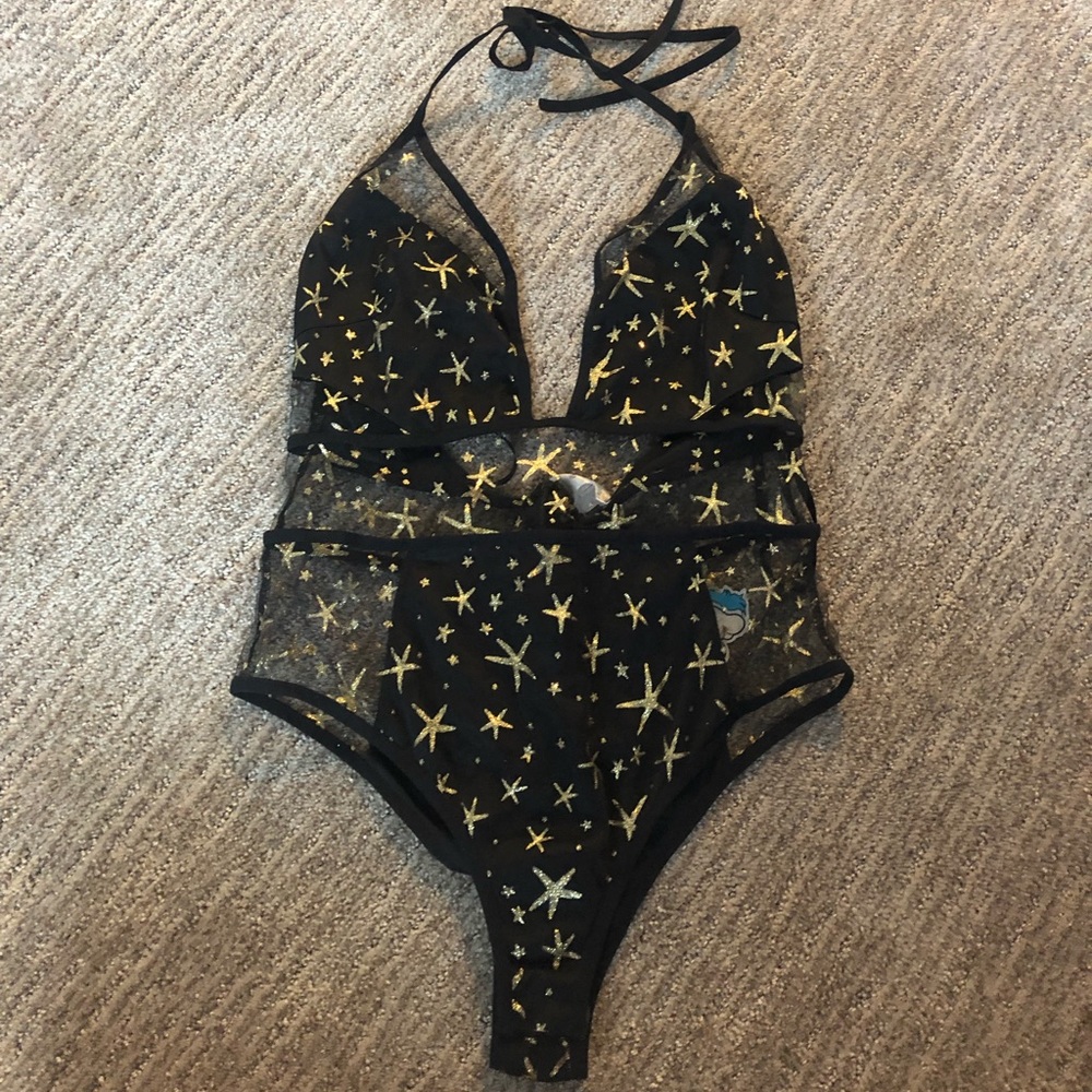 Star mesh bodysuit. Has a zipper in the back.